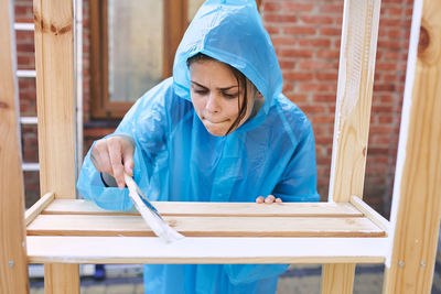 Portrait of young woman working in workshop