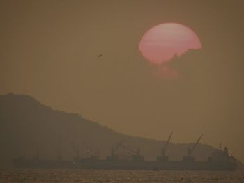 Scenic view of moon at sunset