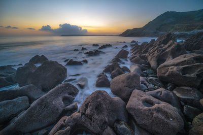 Scenic view of sea against sky during sunset