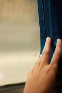 Close-up of hands against blurred background