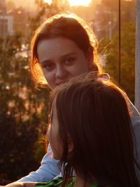 Close-up portrait of smiling young woman