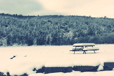 Scenic view of landscape against sky during winter