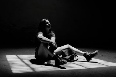 Woman sitting on floor