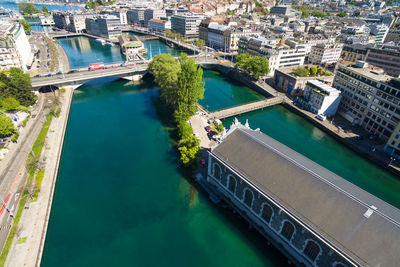 High angle view of river amidst buildings in city