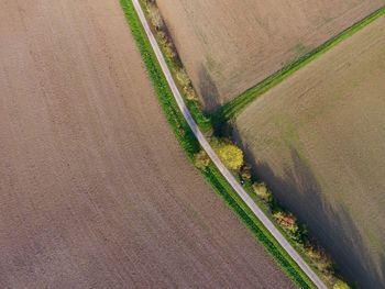 High angle view of road amidst field