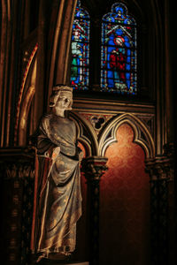 Statue in temple against building