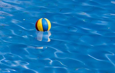 High angle view of ball floating on water in a swimming pool 