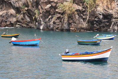 Boats moored in sea