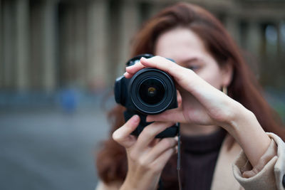 Portrait of man photographing camera