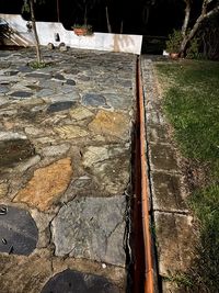 High angle view of footpath by wall