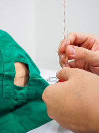 Close-up of man holding hands