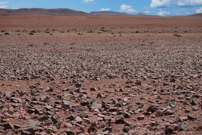 Scenic view of land on field against sky