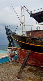 View of fishing boat in sea against sky