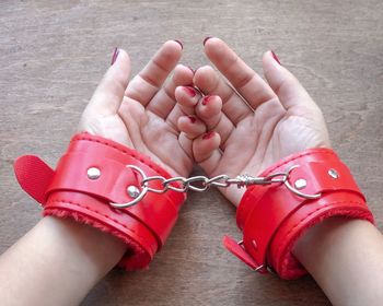 Low section of woman with tattoo on hand