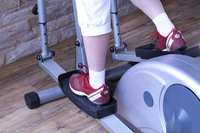 Low section of person exercising in gym