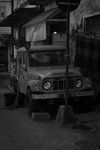 Vehicles on road against buildings in city