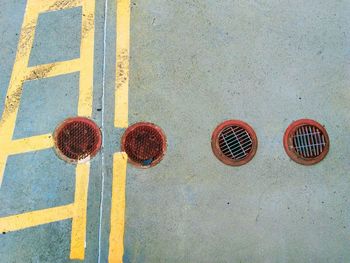 High angle view of manhole on street