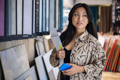 Portrait of young woman using mobile phone