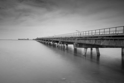 Bridge over river against sky