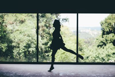 Woman dancing in room