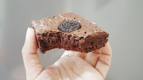Close-up of hand holding ice cream cone
