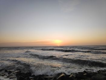 Scenic view of sea against sky during sunset