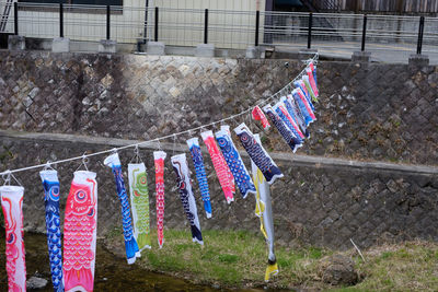 Clothes drying on clothesline against wall