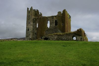 Old ruin building against cloudy sky