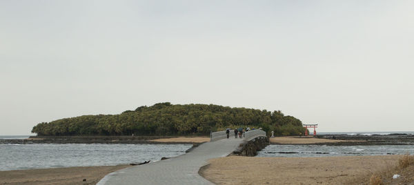 Scenic view of beach against clear sky