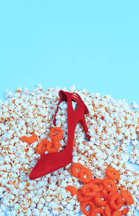 Close-up of red cake against blue background
