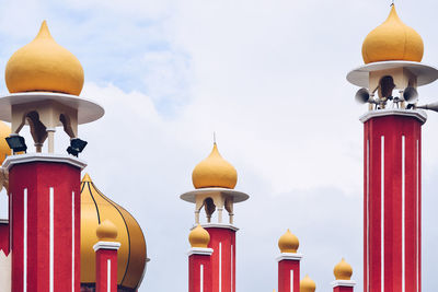 Low angle view of mosque tower against sky