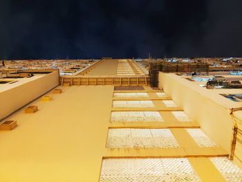 High angle view of illuminated buildings against sky