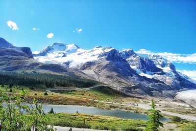 Scenic view of snowcapped mountains against clear sky