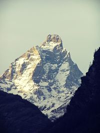Scenic view of snow covered mountain against sky