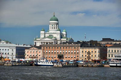 View of buildings against cloudy sky