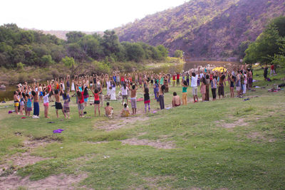 People on grassy field