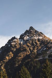 Low angle view of rocks against sky