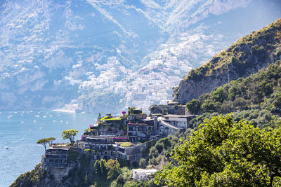 Panoramic view of buildings and mountain against sky