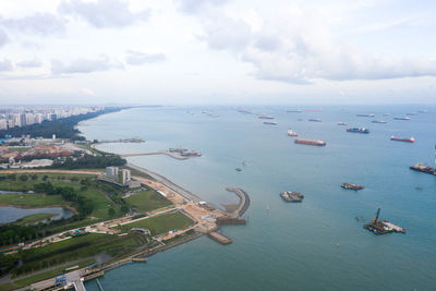 High angle view of boats in sea against sky