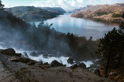 Panoramic view of sea and mountains against sky