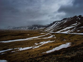 Scenic view of snowcapped mountains against sky