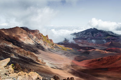 Smoke emitting from volcanic mountain against sky