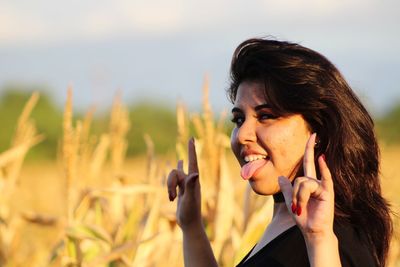 Portrait of woman making face while gesturing