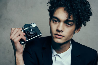 Portrait of young man photographing