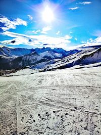 Scenic view of snowcapped mountains against sky