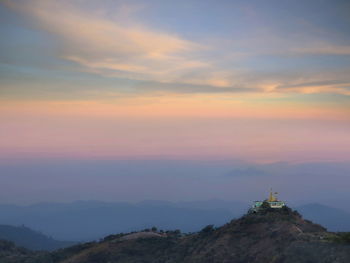 Scenic view of mountain against sky during sunset