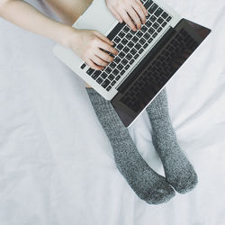 Midsection of person using mobile phone