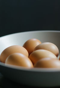 Close-up of eggs in bowl on table