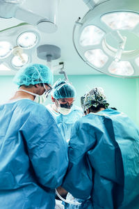 Rear view of man standing in laboratory