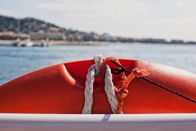 Close-up of rope tied to boat on sea